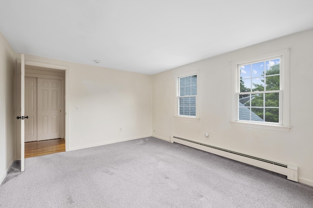12 Copley Pl, South Yarmouth, MA 02664 - carpeted empty room featuring a baseboard heating unit and a smoke detector