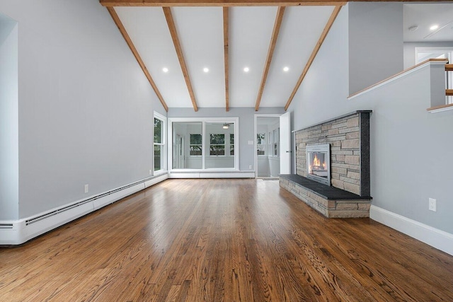 unfurnished living room with high vaulted ceiling, a baseboard heating unit, beam ceiling, and wood finished floors