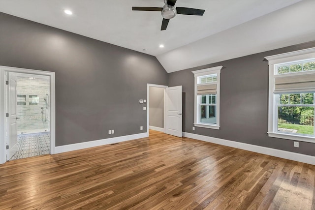 spare room featuring ceiling fan, hardwood / wood-style flooring, and lofted ceiling