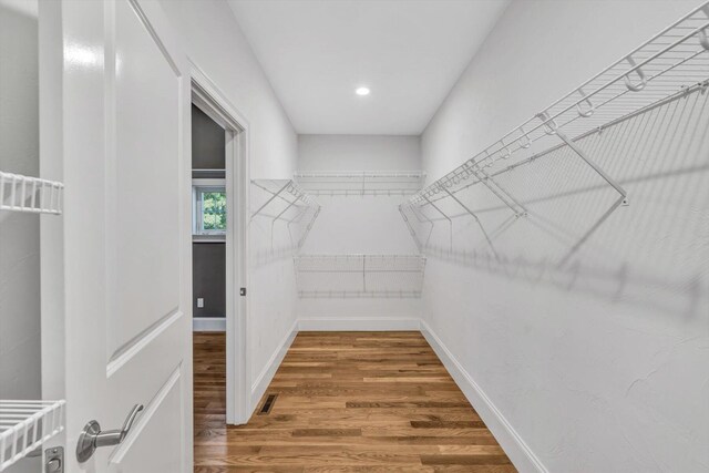 walk in closet featuring wood-type flooring