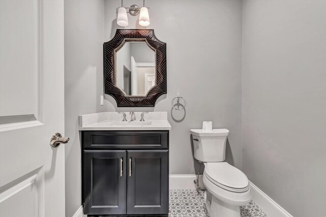 bathroom with toilet and vanity