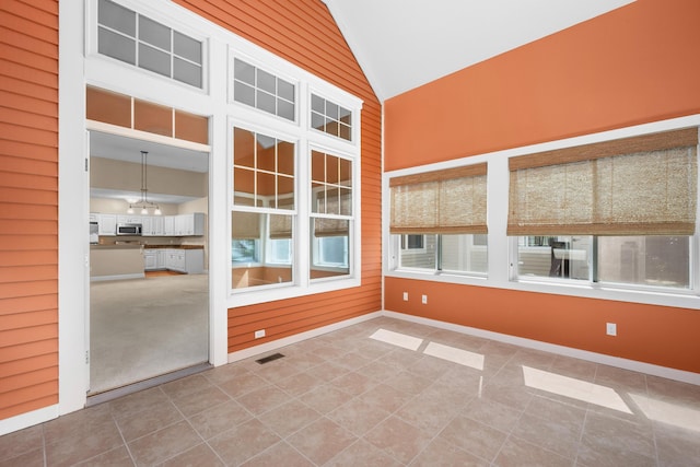 unfurnished sunroom with visible vents