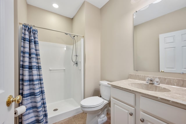 full bathroom featuring a shower with curtain, tile patterned floors, vanity, and toilet