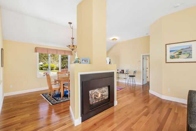 240 Surf Dr, Mashpee, MA 02649 - living area featuring light wood-style flooring, vaulted ceiling, and baseboards
