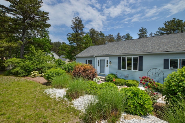 240 Surf Dr, Mashpee, MA 02649 - ranch-style home featuring an attached garage, driveway, a shingled roof, and a front lawn
