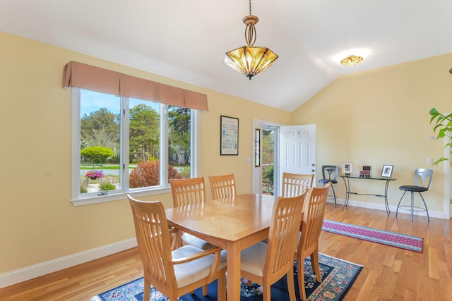 240 Surf Dr, Mashpee, MA 02649 - dining space featuring baseboards, light wood-style flooring, and vaulted ceiling