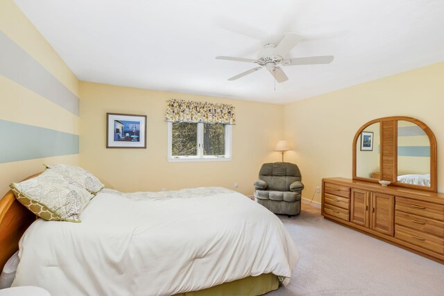 240 Surf Dr, Mashpee, MA 02649 - carpeted bedroom with baseboards and a ceiling fan