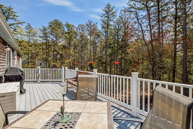 240 Surf Dr, Mashpee, MA 02649 - wooden deck featuring outdoor dining space and a grill