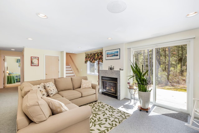 240 Surf Dr, Mashpee, MA 02649 - living room with light carpet, recessed lighting, stairway, and a fireplace