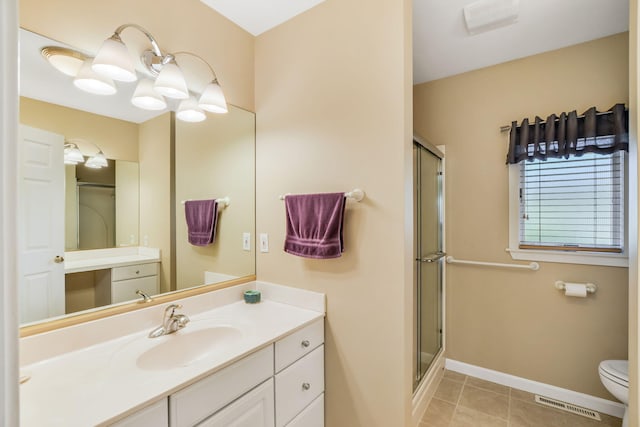 240 Surf Dr, Mashpee, MA 02649 - full bath featuring a stall shower, baseboards, tile patterned floors, vanity, and toilet
