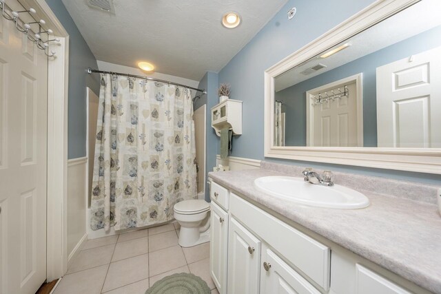 151 Leisure Green Dr N, Mashpee, MA 02649 - full bathroom with tile patterned floors, vanity, and shower / bathtub combination with curtain