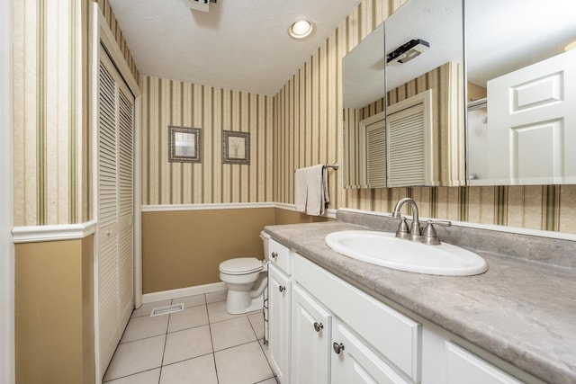 151 Leisure Green Dr N, Mashpee, MA 02649 - full bath with wallpapered walls, vanity, tile patterned floors, and a closet