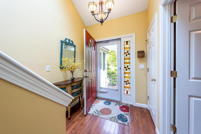 151 Leisure Green Dr N, Mashpee, MA 02649 - foyer featuring hardwood / wood-style flooring, a chandelier, and lofted ceiling