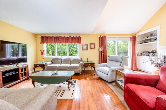 151 Leisure Green Dr N, Mashpee, MA 02649 - living area with light wood-style floors and vaulted ceiling