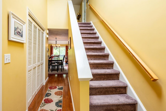 151 Leisure Green Dr N, Mashpee, MA 02649 - stairway featuring wood finished floors and a chandelier