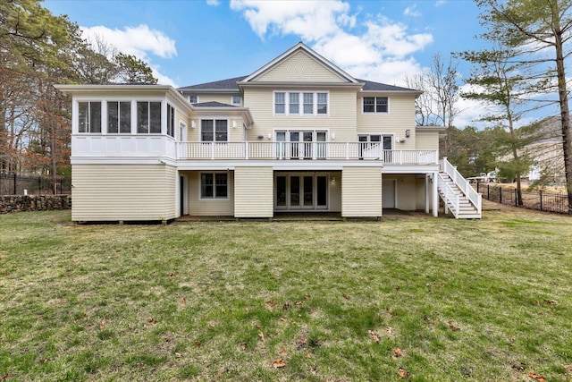 24 Pleasant Park Dr, Mashpee, MA 02649 - rear view of house with stairway, a sunroom, and a deck