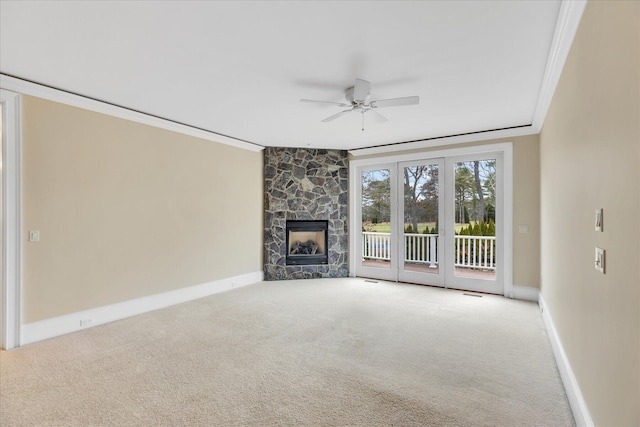 24 Pleasant Park Dr, Mashpee, MA 02649 - unfurnished living room with crown molding, ceiling fan, carpet floors, and a stone fireplace