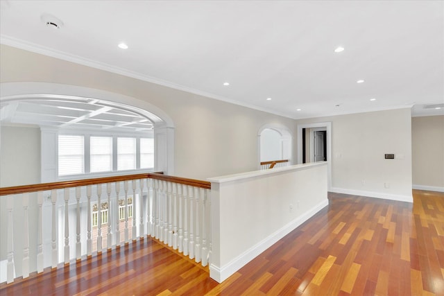 24 Pleasant Park Dr, Mashpee, MA 02649 - corridor featuring wood finished floors, recessed lighting, crown molding, arched walkways, and an upstairs landing