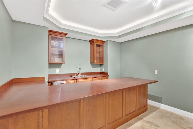 24 Pleasant Park Dr, Mashpee, MA 02649 - kitchen with a tray ceiling, glass insert cabinets, light countertops, and a peninsula