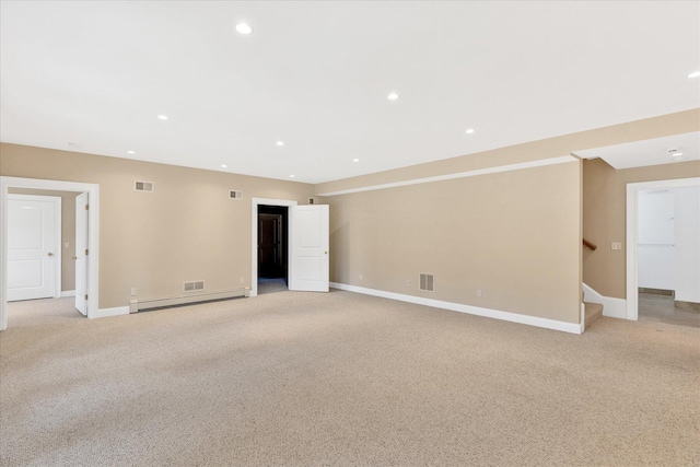 24 Pleasant Park Dr, Mashpee, MA 02649 - empty room with light colored carpet, baseboard heating, stairway, and recessed lighting