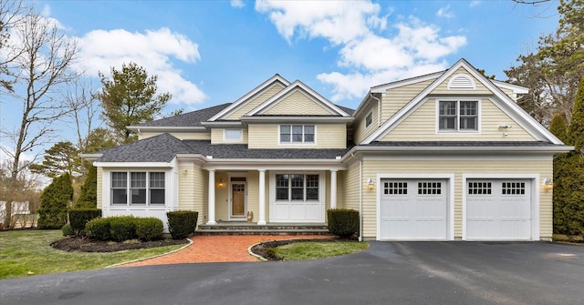 24 Pleasant Park Dr, Mashpee, MA 02649 - view of front of house with asphalt driveway, covered porch, and an attached garage