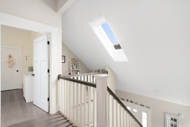 675 Main St Unit C1, Cotuit, MA 02635 - hall with a skylight, plenty of natural light, wood finished floors, lofted ceiling, and an upstairs landing