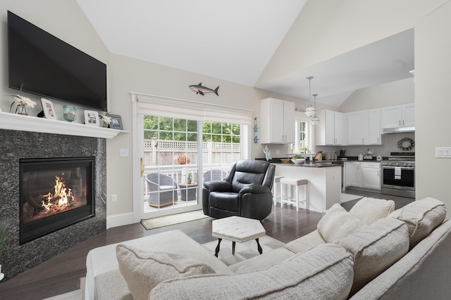 675 Main St Unit C1, Cotuit, MA 02635 - living room featuring vaulted ceiling, dark wood-style floors, and a premium fireplace