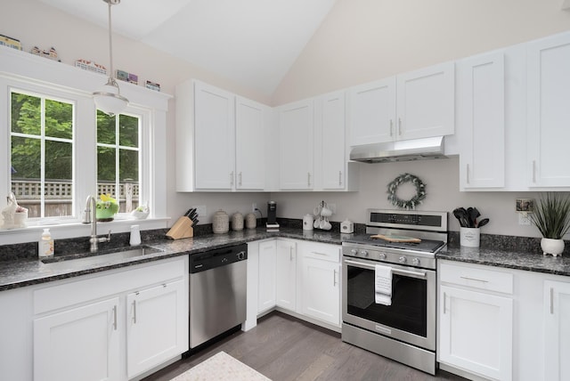 675 Main St Unit C1, Cotuit, MA 02635 - kitchen with appliances with stainless steel finishes, under cabinet range hood, vaulted ceiling, white cabinets, and dark wood finished floors