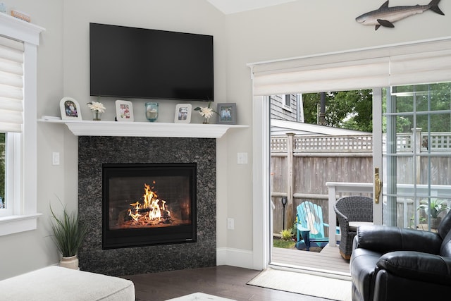 675 Main St Unit C1, Cotuit, MA 02635 - living room with a fireplace, wood finished floors, and plenty of natural light