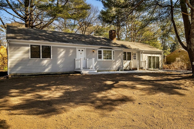 single story home with a chimney