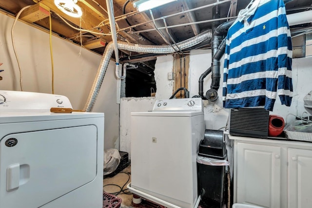 laundry area featuring cabinets and independent washer and dryer