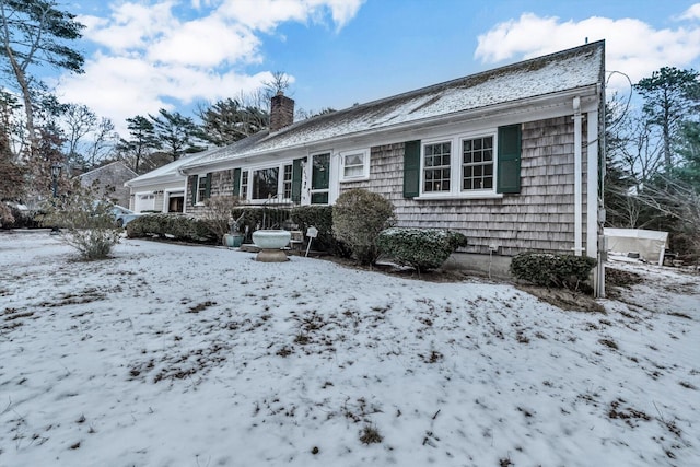 view of snow covered house