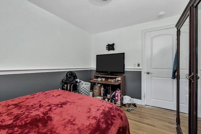 bedroom with light hardwood / wood-style floors