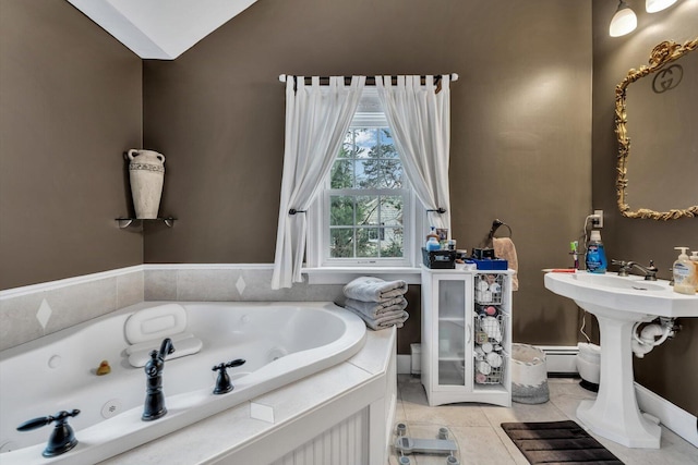 bathroom with baseboard heating, tiled bath, lofted ceiling, and tile patterned floors