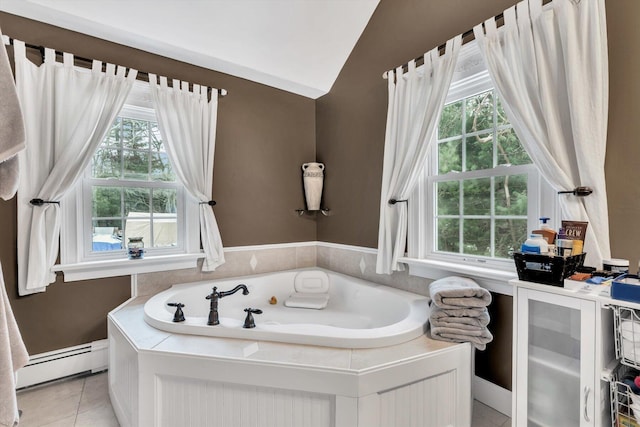 bathroom featuring a bathtub, tile patterned floors, a baseboard radiator, and lofted ceiling