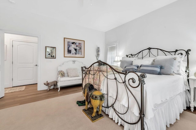 bedroom featuring light carpet