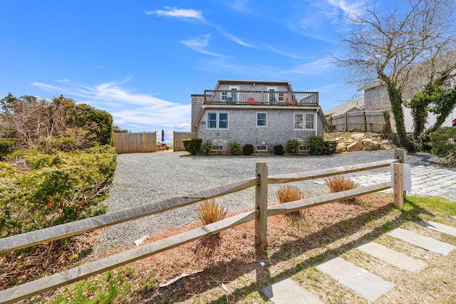 133 Breakwater Shores Dr, Hyannis, MA 02601 - victorian home featuring a balcony and fence