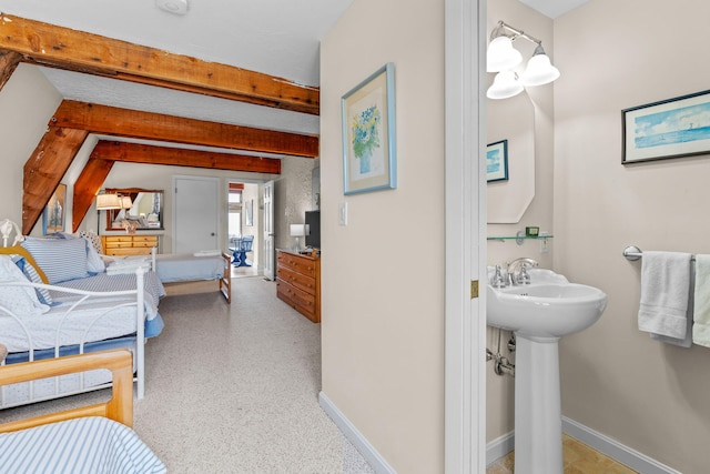 133 Breakwater Shores Dr, Hyannis, MA 02601 - interior space with beamed ceiling, baseboards, and a sink