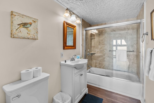 133 Breakwater Shores Dr, Hyannis, MA 02601 - full bathroom with wood finished floors, enclosed tub / shower combo, vanity, and toilet
