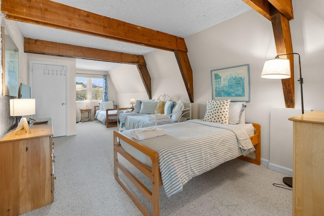 133 Breakwater Shores Dr, Hyannis, MA 02601 - carpeted bedroom with beamed ceiling, baseboards, and a textured ceiling