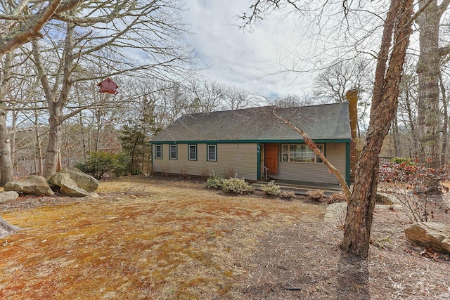 view of front of home featuring a chimney