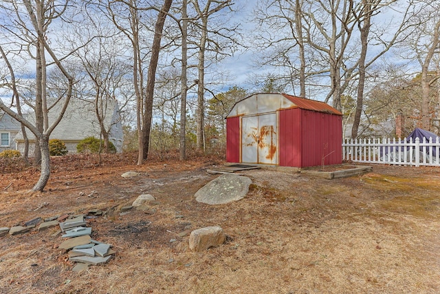 view of shed with fence