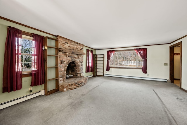 unfurnished living room with a baseboard heating unit, ornamental molding, carpet floors, and a baseboard radiator