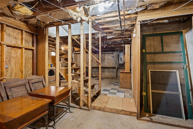 unfinished basement with washer / clothes dryer