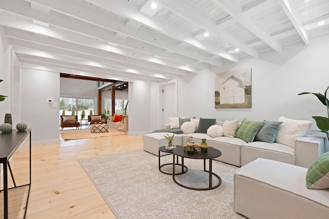 living room with wood-type flooring, baseboards, beamed ceiling, and recessed lighting