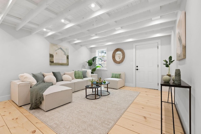 living area with wood ceiling, beam ceiling, baseboards, and hardwood / wood-style floors