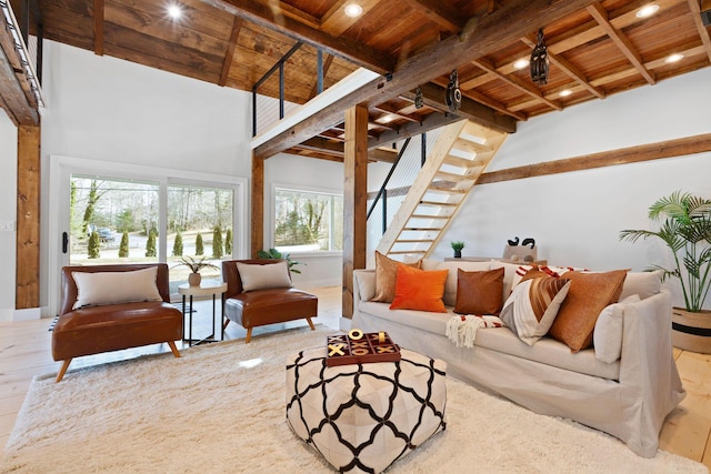 living room with beam ceiling, wooden ceiling, and hardwood / wood-style floors