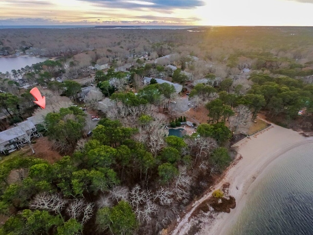 aerial view at dusk with a water view