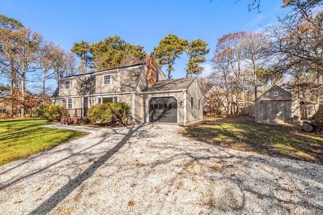 view of front facade featuring a garage and a front lawn