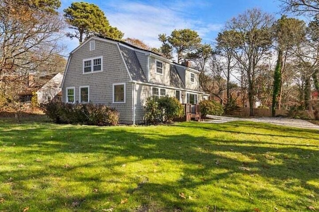 rear view of house with a lawn